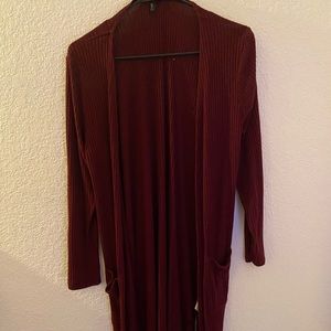 Selling a burgundy cardigan.